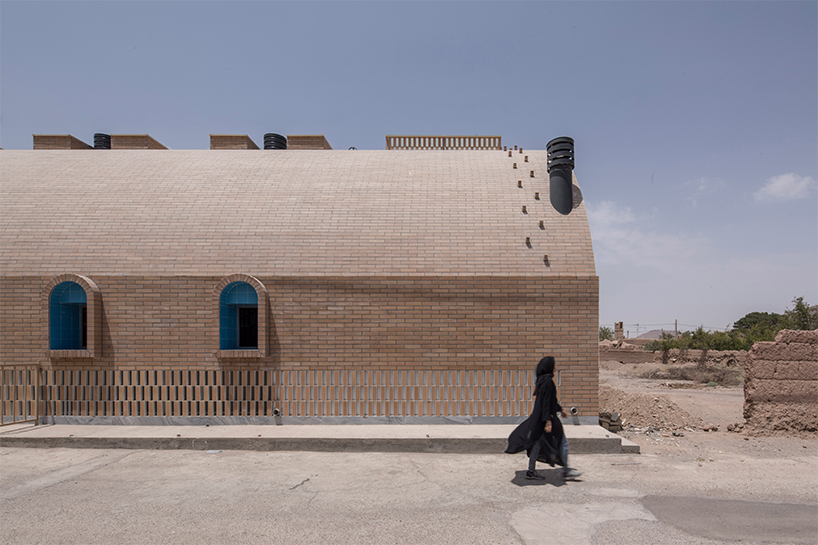 brick and turquoise tiles clad vaulted aghajoon communal kitchen in iran
